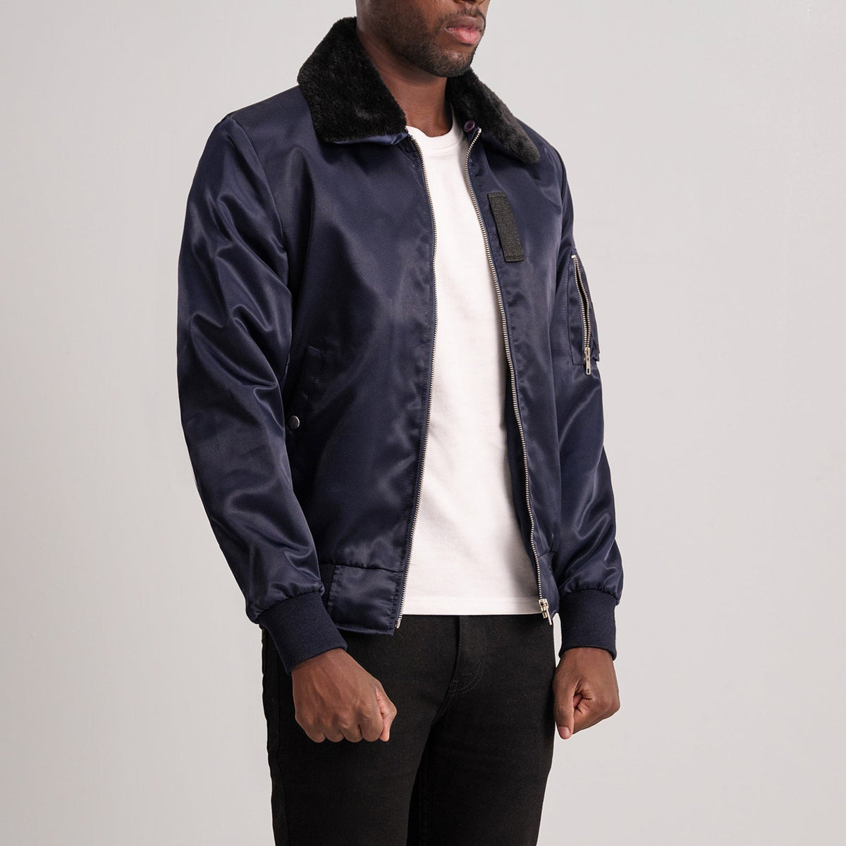 
Blue Satin Bomber Jacket - عرض خلفي يوضح تفصيل الأكتاف المتقن والحاشية النظيفة