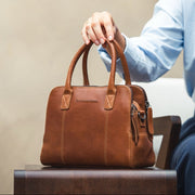 Styled Fit Perspective of Ezra Full-Grain Leather Handbag نسائي on Model - Natural Daylight Drape